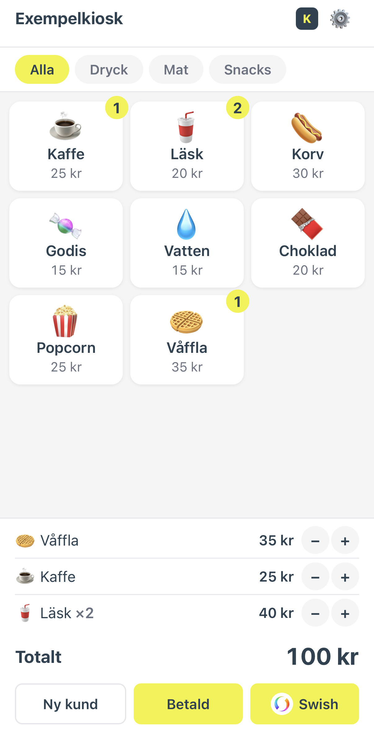 Kioskkassan kassavy med produkter och varukorg